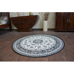 Runder Sisalteppich mit glatter Textur, ideal für Schlafzimmer