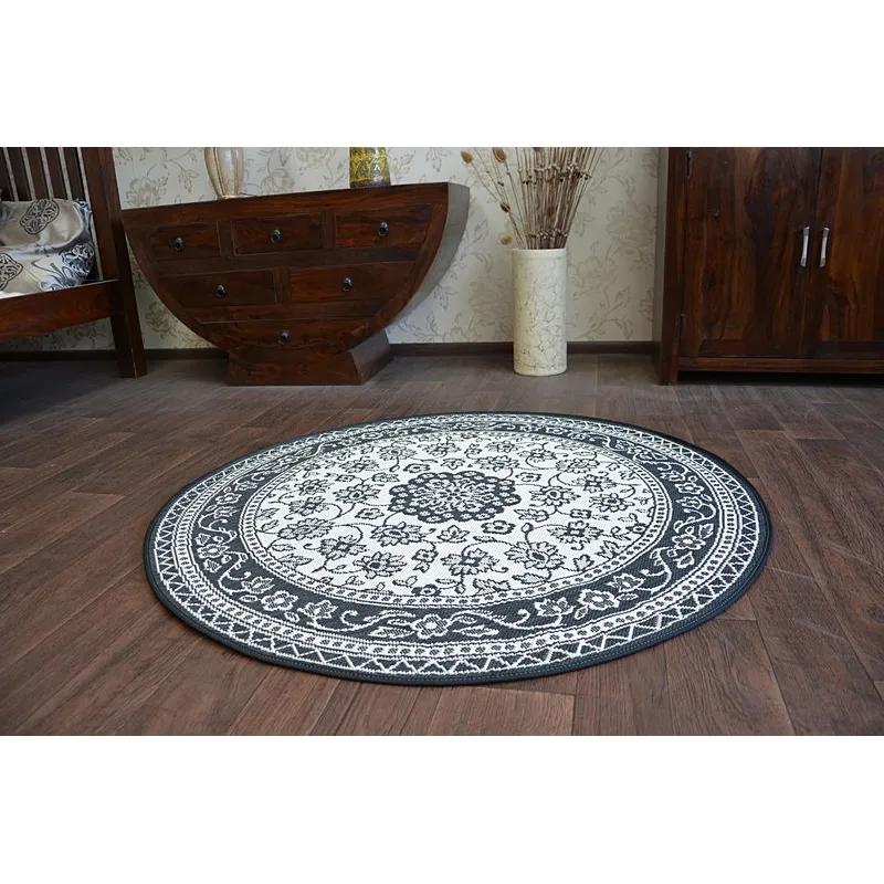 Runder Sisalteppich mit glatter Textur, ideal für Schlafzimmer